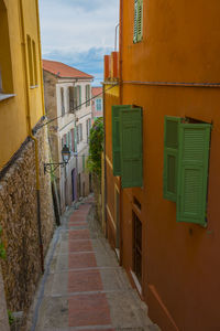 Alley amidst buildings in city