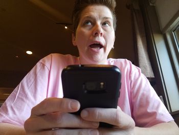 Close-up of woman sitting at restaurant