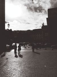 Silhouette of woman in city