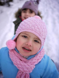 Portrait of cute smiling girl in snow