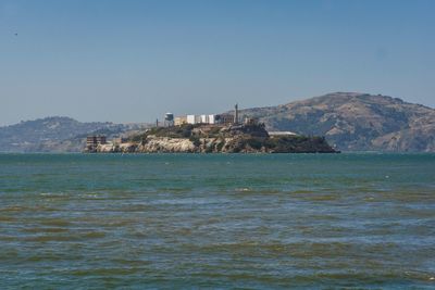 Scenic view of sea against clear blue sky