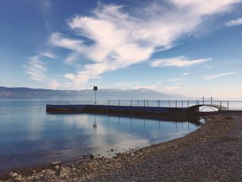 View of calm sea against cloudy sky