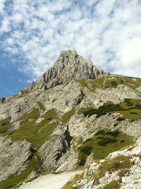 Scenic view of mountains against cloudy sky