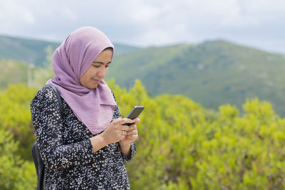 Young woman using mobile phone