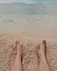 Low section of person on beach