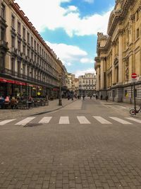 City street against cloudy sky