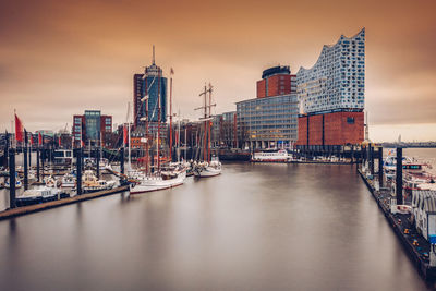 Boats moored at harbor