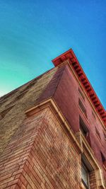 Low angle view of building against clear blue sky