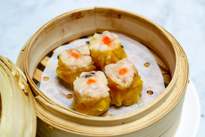 Close-up of dumpling in wooden container