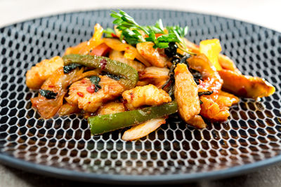 Close-up of chicken in plate on table