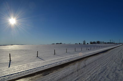 Panoramic view of road against clear blue sky