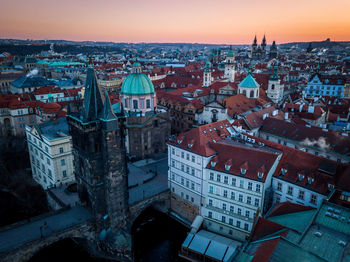 High angle view of town against sky at sunset