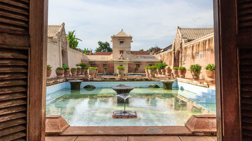 Reflection of buildings in swimming pool