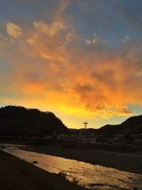 Scenic view of mountains against sky at sunset