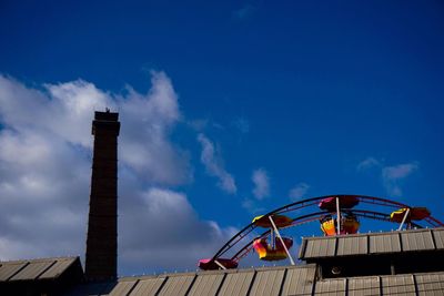 Low angle view of built structure against blue sky