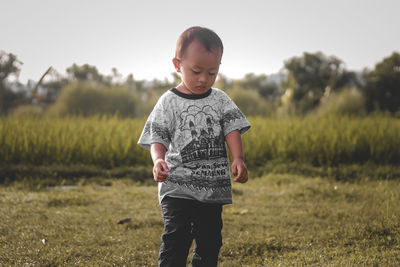 Boy standing on field