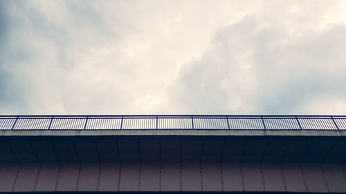 Low angle view of bridge against sky in city