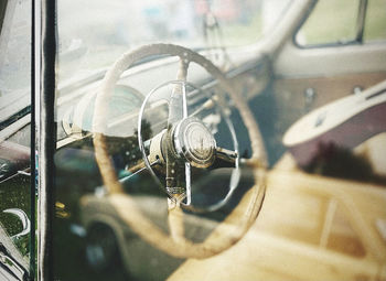 Close-up of machine part through car window