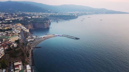 High angle view of townscape by sea