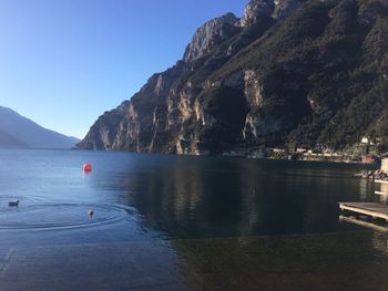 Scenic view of sea against clear blue sky