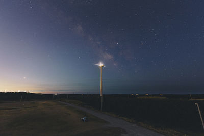 Road against sky at night