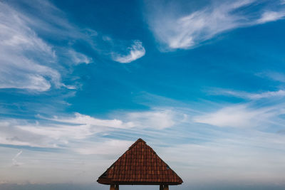 Lifeguard hut against blue sky