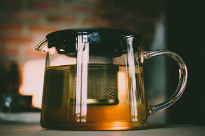 Close-up of glass jar on table