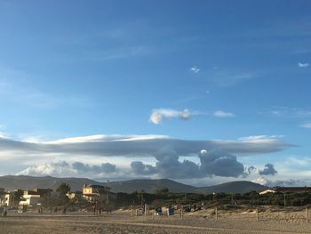 Scenic view of mountains against cloudy sky