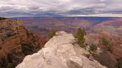 Scenic view of mountains against cloudy sky