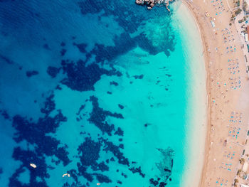 High angle view of people swimming in sea