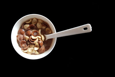 High angle view of breakfast on table against black background