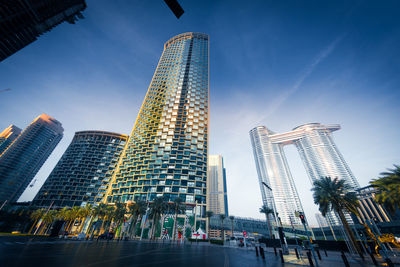 Low angle view of skyscrapers lit up at night