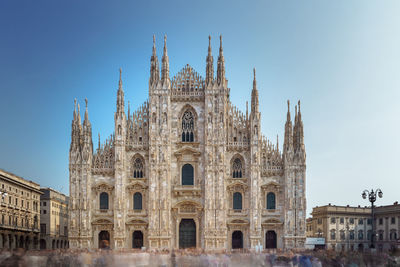 Facade of historic building against sky, duomo di milano / catholic church, milano / italy