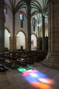 View of church and buildings seen through glass window