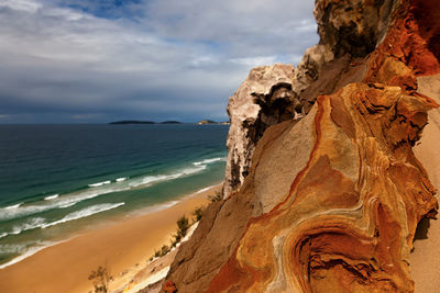 Scenic view of sea against cloudy sky