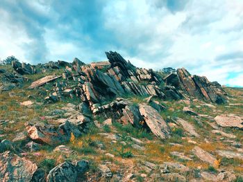 Panoramic view of rock formations against sky