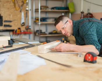 Portrait of young man working at table