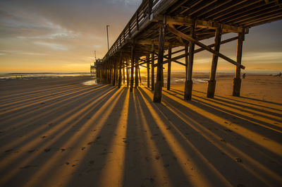 Scenic view of beach against sky during sunset