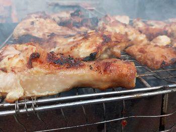 High angle view of meat on barbecue grill