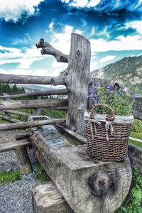 Scenic view of field against cloudy sky