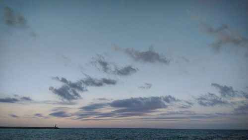 Scenic view of sea against sky at sunset