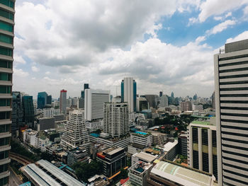 Modern buildings in city against sky