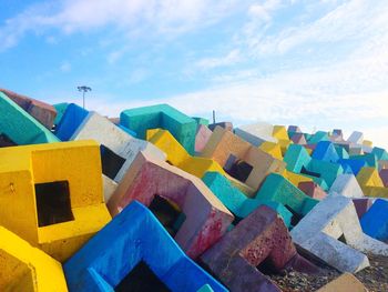 Multi colored beach against blue sky