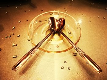 High angle view of water drops on glass table