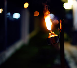 Close-up of illuminated lamp against blurred background