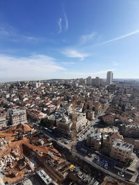 High angle view of buildings in city against sky