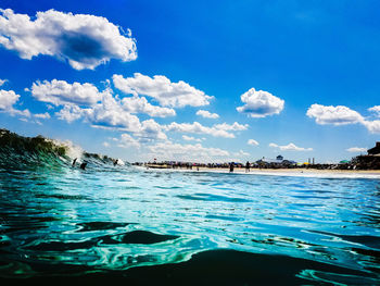 Scenic view of sea against cloudy sky