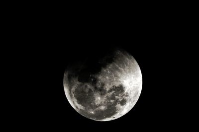 Low angle view of moon against clear sky at night