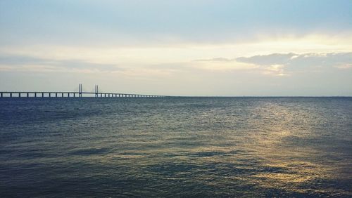 Scenic view of sea against cloudy sky