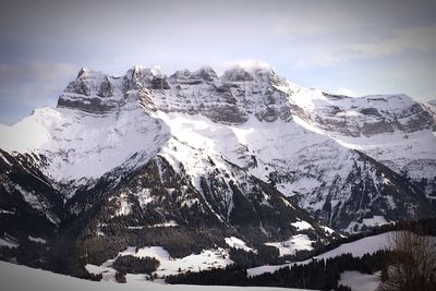 Scenic view of snowcapped mountain against sky